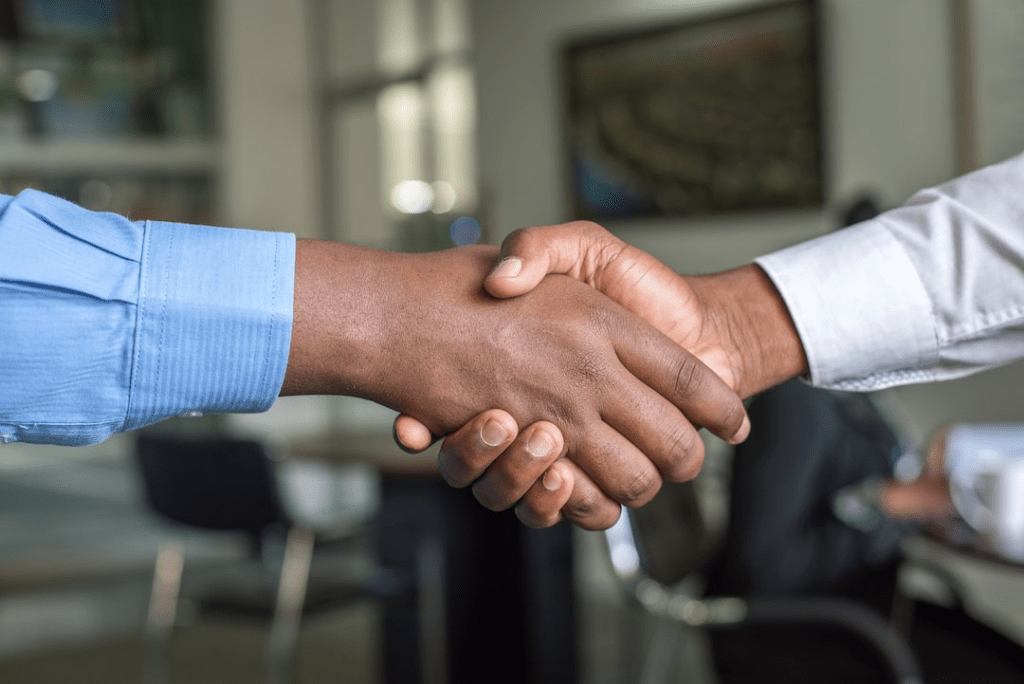 hands-clasped-in-agreement-for-concrete-ordering-software